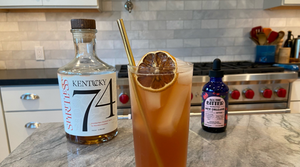 alcohol-free bourbon paloma mocktail with spiritless kentucky 74 non-alcoholic bourbon