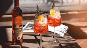 non-alcoholic aperol spritz cocktail/mocktail with wilfred's orange rosemary bittersweet aperitif