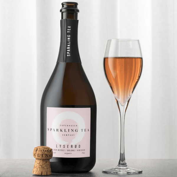 Copenhagen Sparkling Tea LYSERØD non-alcoholic wine alternative open bottle with glass