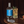 Load image into Gallery viewer, Lyre's Gin Alternative bottle next to a Gin Gin Mule mocktail
