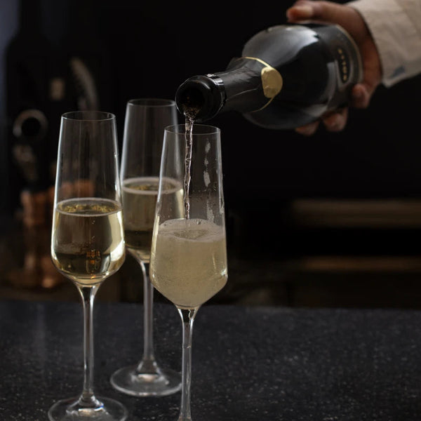 Pouring BOLLE Grand Reserve into champagne flutes